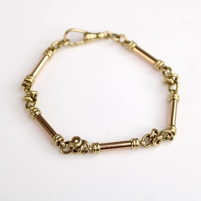 Lot 137 - A 9ct yellow and rose gold fancy knot and...