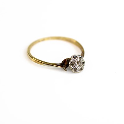 Lot 266 - A yellow and white metal broken cluster ring,...