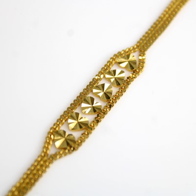 Lot 252 - A yellow metal filed two-row curblink bracelet,...