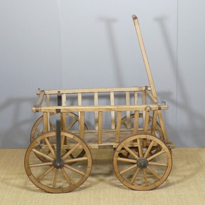 Lot 703 - A vintage stained elm and iron bound cart