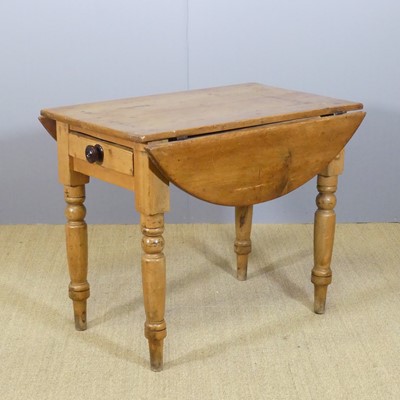 Lot 689 - A Victorian pine drop-flap kitchen table,...