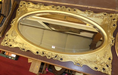 Lot 521 - A gilt compisition framed wall mirror