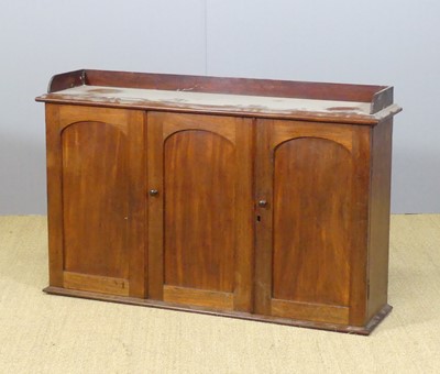 Lot 593 - A Victorian mahogany three door wall cupboard,...