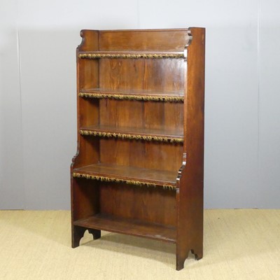 Lot 645 - An Arts & Crafts walnut freestanding open...