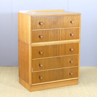 Lot 672 - A 1970s blond oak veneered chest of five long...