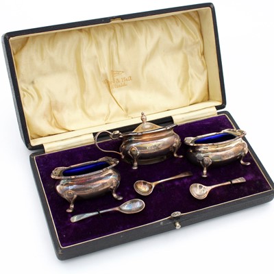 Lot 215 - A cased George V silver Walker & Hall cruet...