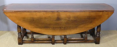 Lot 619 - A contemporary joined oak wake table, the full...