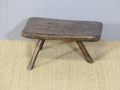 Lot 671 - A 19th century provincial elm three-legged...