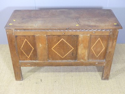 Lot 639 - An 18th century joined oak three-panelled...
