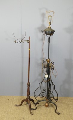 Lot 664 - An Edwardian iron scrollwork standard lamp...