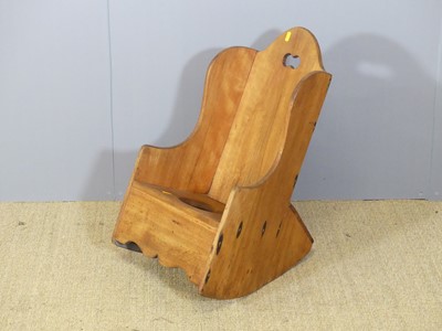 Lot 631 - A rustic stained beech child's rocking commode...