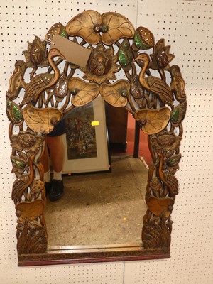 Lot 604 - An Eastern carved and polychrome decorated...
