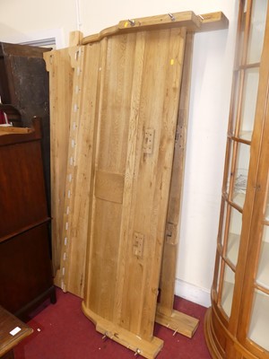 Lot 611 - A contemporary blond oak super kingsize sleigh...