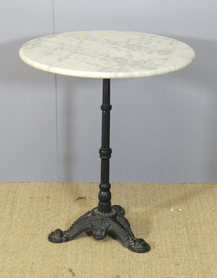 Lot 614 - A cast iron based and white variegated marble...