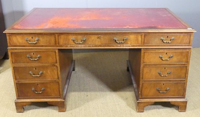 Lot 624 - A mahogany twin pedestal writing desk, having...