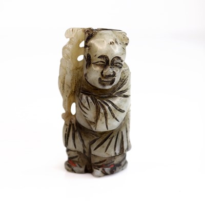 Lot 249 - A 20th century carved jade figure of a boy...