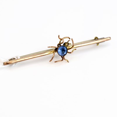Lot 261 - A 9ct gold blue topaz set safety pin bar...