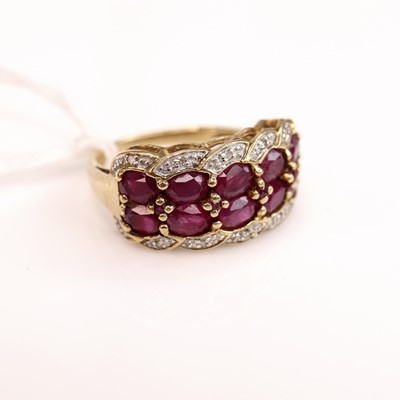 Lot 268 - A yellow metal, ruby and diamond point set...