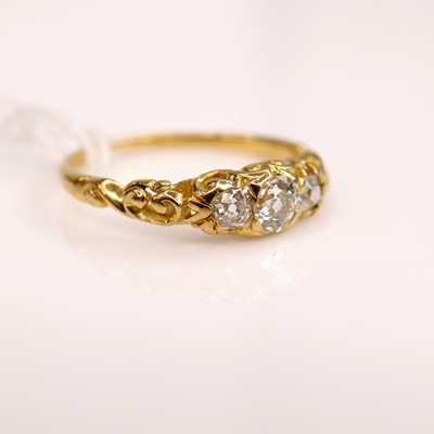 Lot 277 - A circa 1900 carved yellow metal diamond three-...