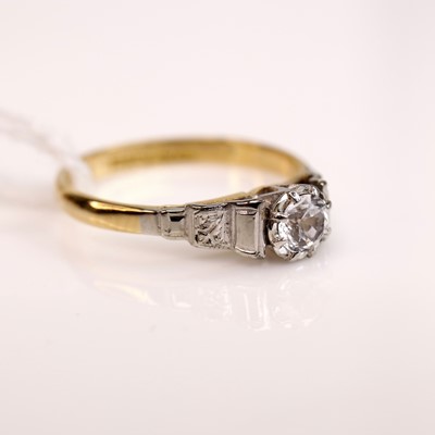 Lot 283 - An 18ct gold diamond solitaire ring, the claw...