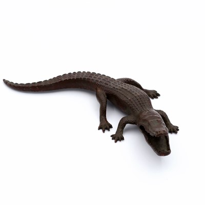 Lot 180 - A contemporary bronzed cast metal crocodile,...