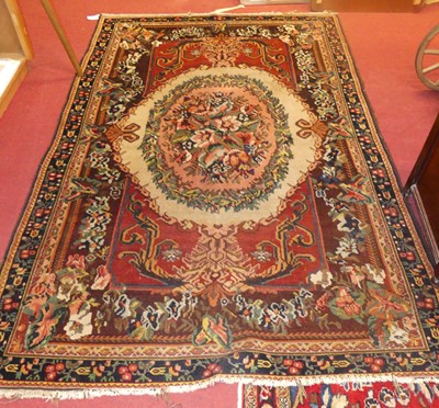Lot 734 - A Persian woollen Turkaman rug, having a rust...