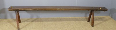Lot 691 - A 19th century rustic elm long bench, length...