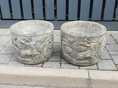 Lot 767 - A pair of reconstituded stone garden planters,...