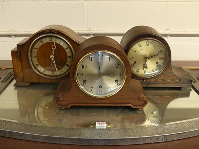 Lot 133 - A 1930s walnut cased mantel clock, having an...