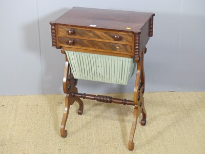 Lot 704 - A Regency mahogany two-drawer work table, with...