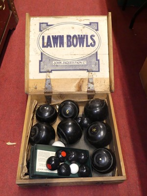 Lot 152 - A set of Jaques lawn bowls, in original pine...