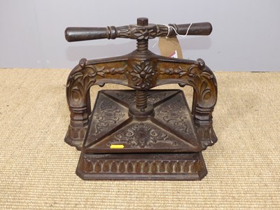 Lot 720 - An Edwardian cast iron square book press, with...