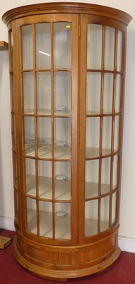 Lot 727 - A contemporary pine demi-lune single door...