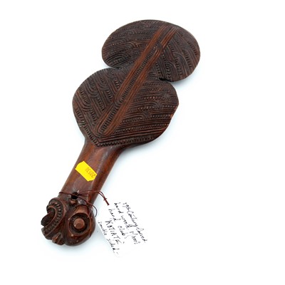 Lot 232 - A Maori carved hardwood double-sided...
