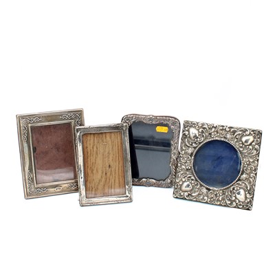 Lot 175 - Four variously decorated silver clad easel...