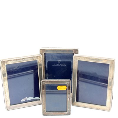 Lot 174 - Four Elizabeth II silver clad easel photograph...