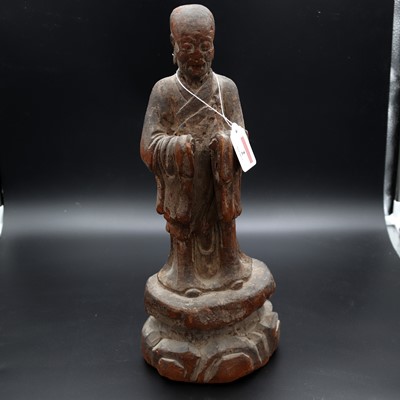 Lot 2 - A Japanese carved softwood figure of a scholar,...