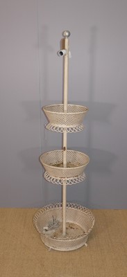 Lot 601 - A painted pierced metal circular three-tier...