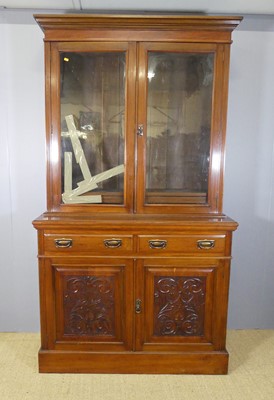 Lot 610 - A late Victorian walnut bookcase cupboard,...