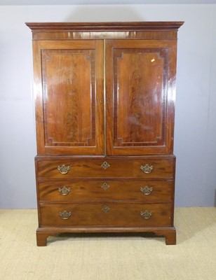 Lot 622 - A 19th century mahogany linen press, the twin...