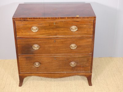 Lot 636 - A Regency mahogany square front chest of three...