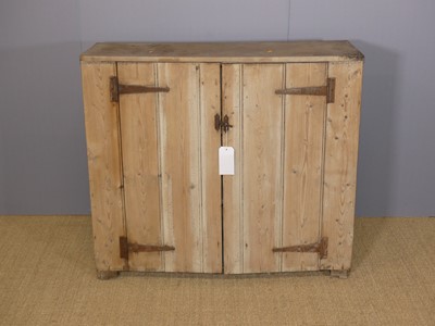 Lot 640 - A rustic panelled pine low double door side...