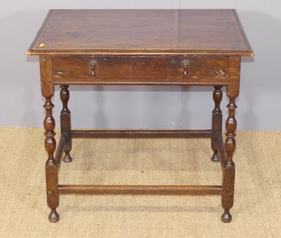 Lot 641 - An antique joined oak low single drawer side...