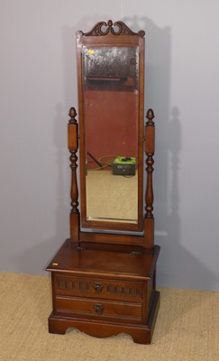 Lot 646 - An Old Charm oak cheval mirror, having hinged...