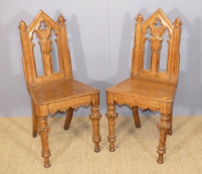 Lot 650 - A pair of mid-Victorian Gothic revival oak...