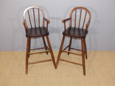 Lot 654 - A pair of child's beech stickback high chairs