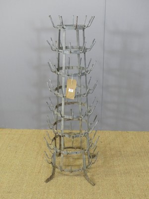 Lot 659 - A galvanised metal tiered freestanding bottle...