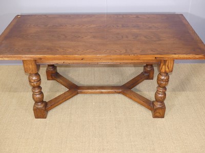 Lot 667 - A contemporary joined oak draw-leaf refectory...