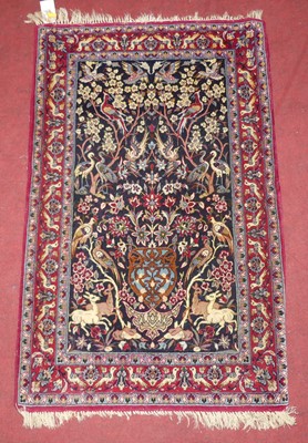 Lot 749 - A Persian woollen blue, red and cream ground...