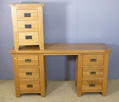 Lot 704 - A contemporary joined blond oak kneehole long...